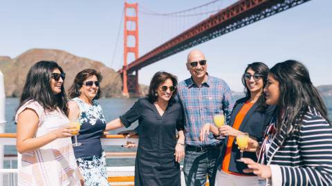 A family has fun in front of the Golden Gate Bridge